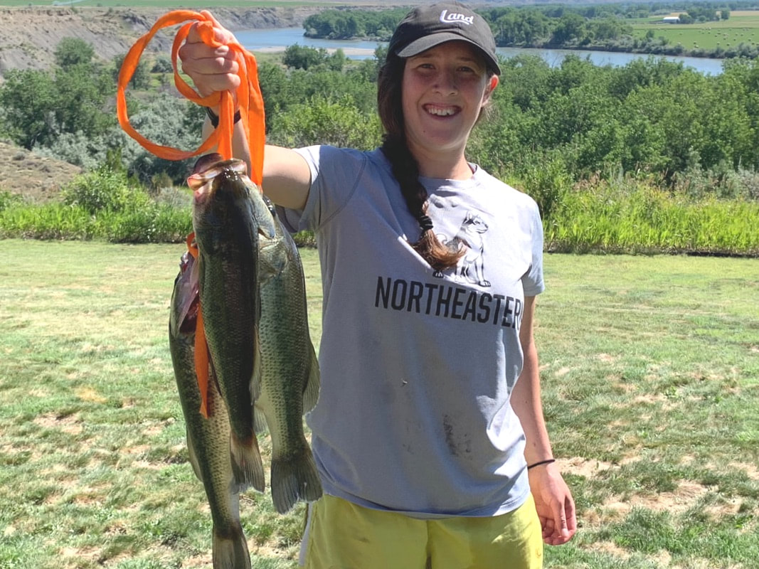 Our intern quickly learned to catch big bass in Fish Fry Lake